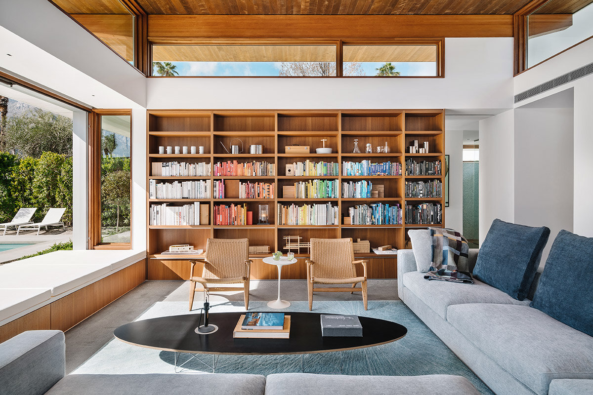Bookshelves in a great room with a living platform and clerestory windows