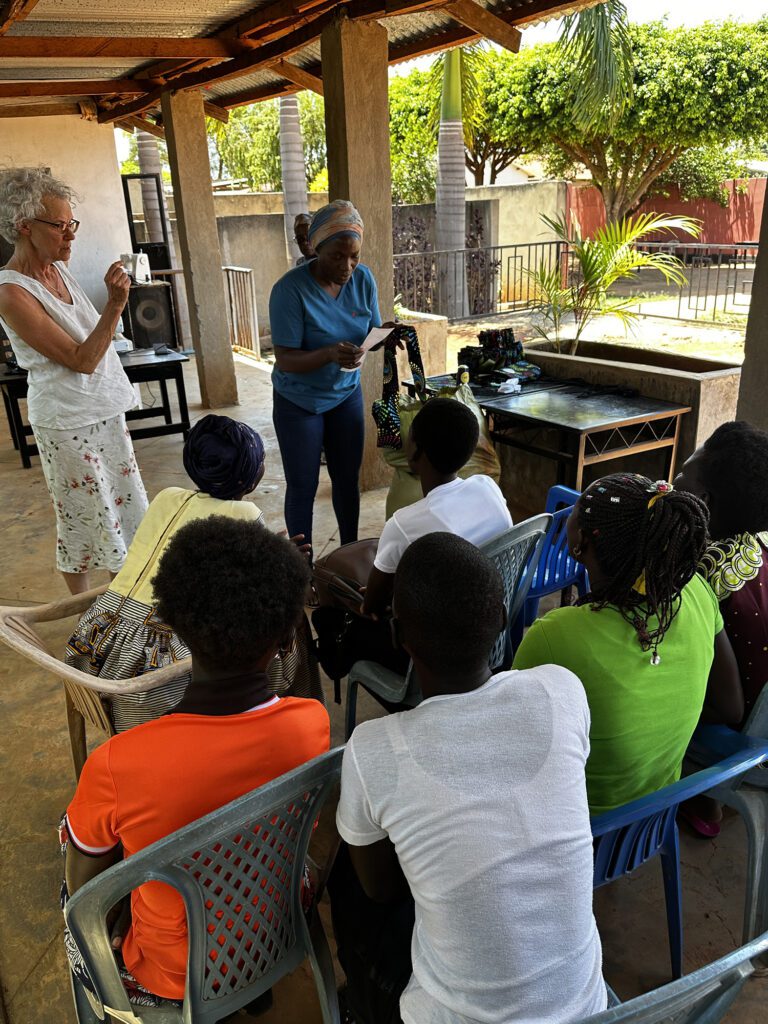 MoonCatcher Project staff teach a sewing class in Uganda. 