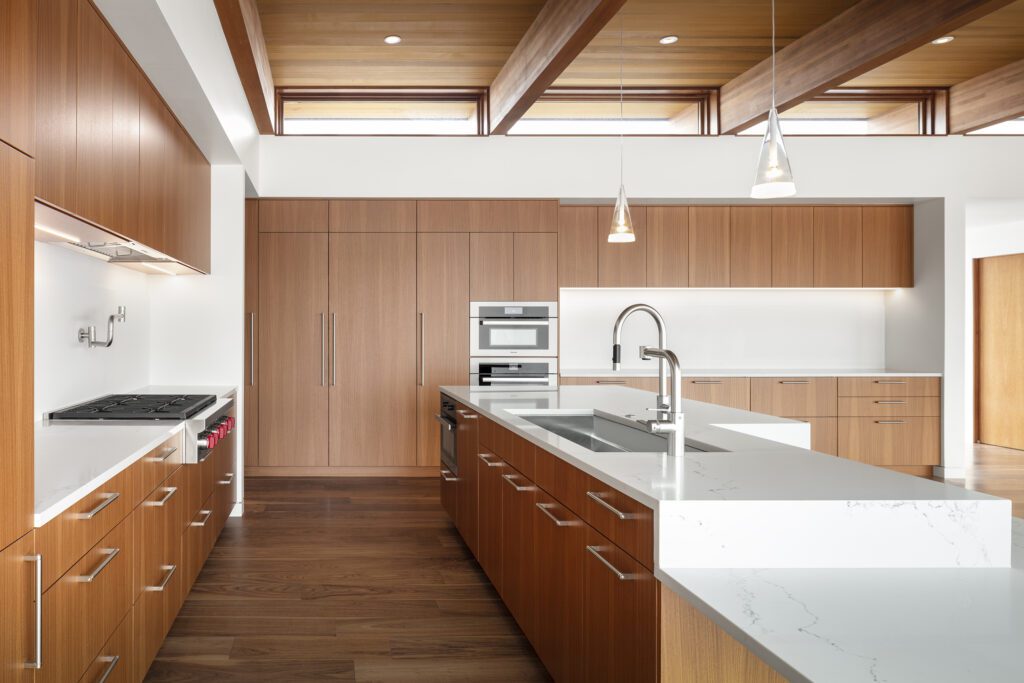 Modern accessible kitchen outfitted with extensive wooden cabinetry